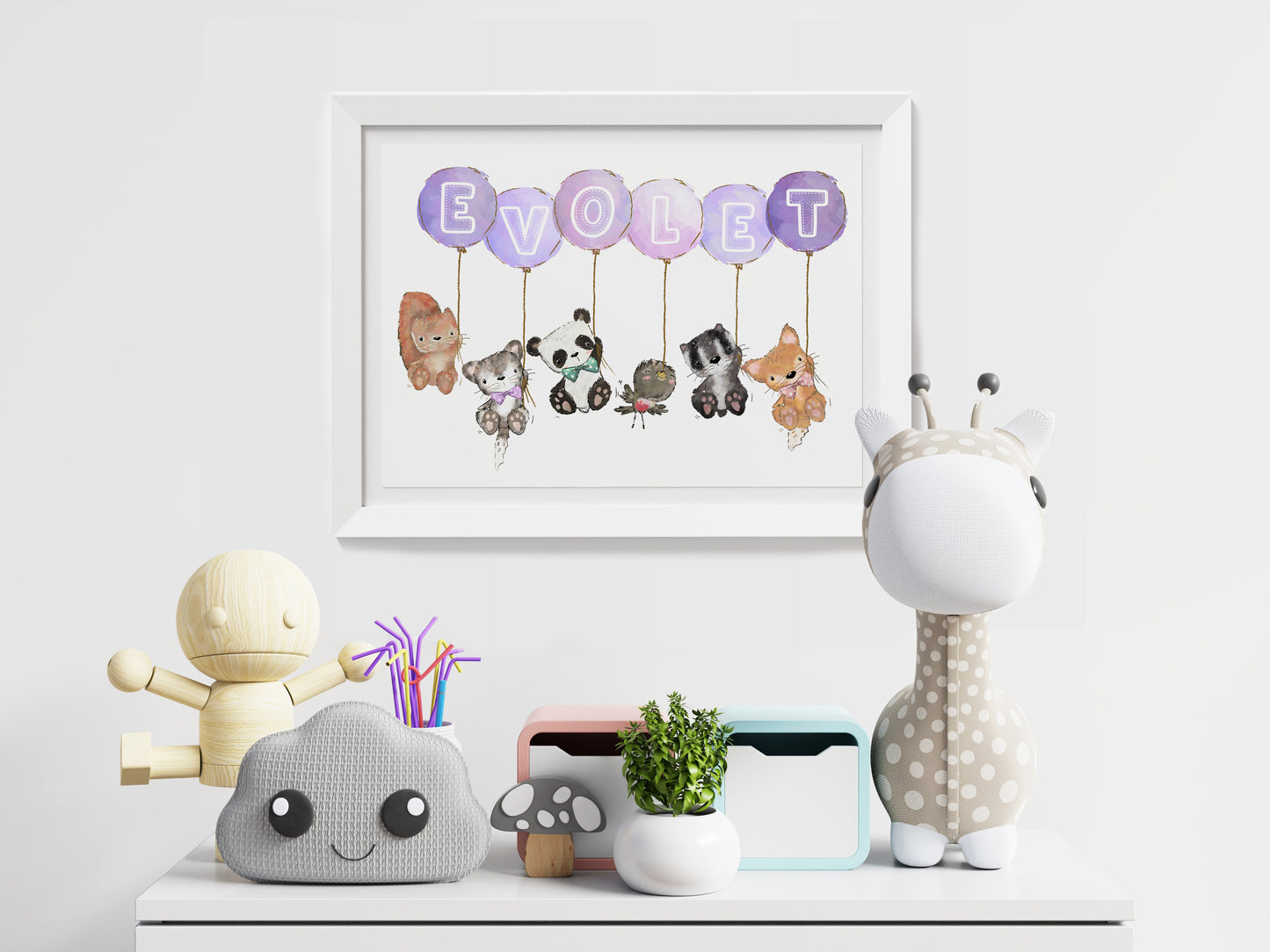 animals holding balloons with letters of baby name on balloons