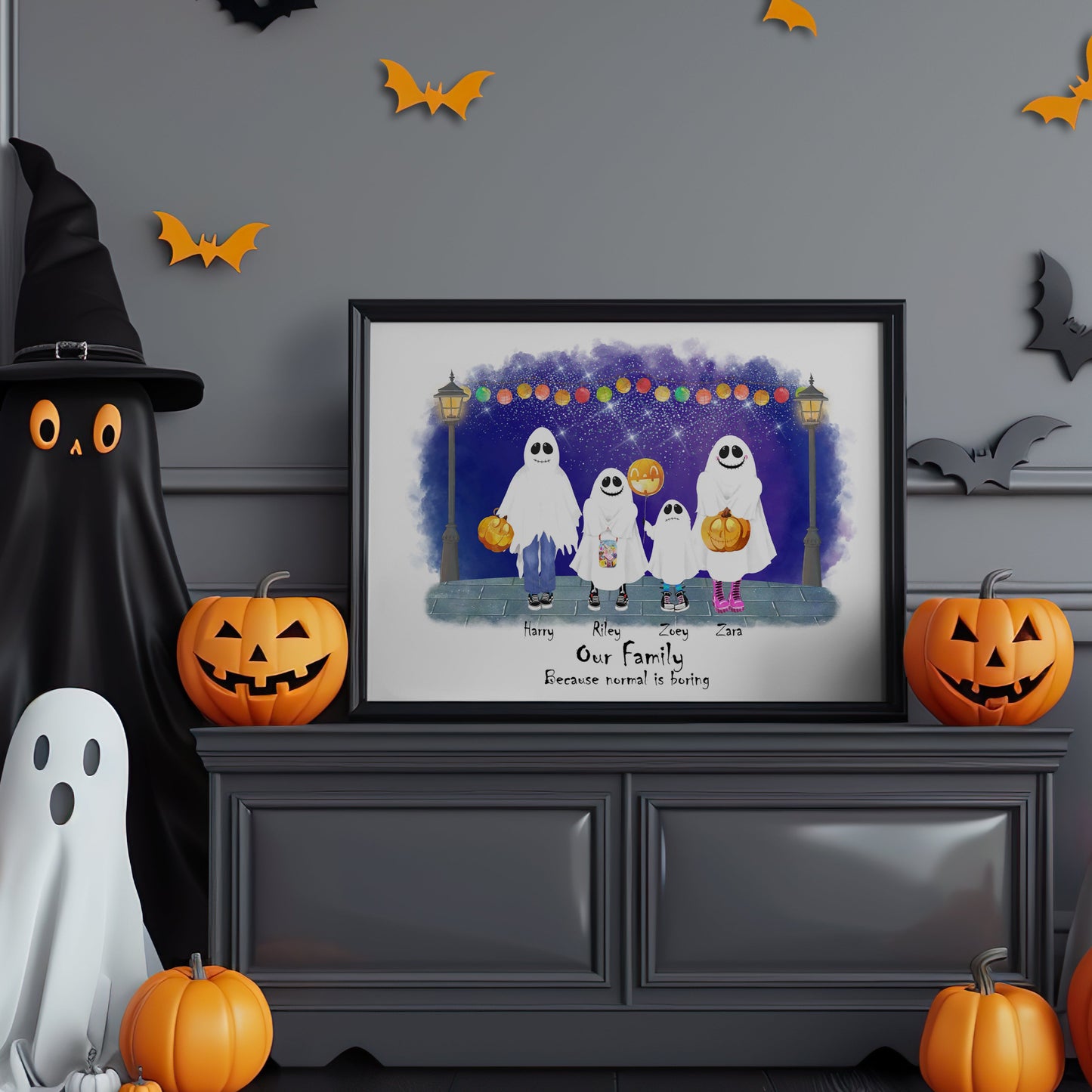 Halloween-themed room with framed family portrait, pumpkins, ghosts, and bats on a gray wall.