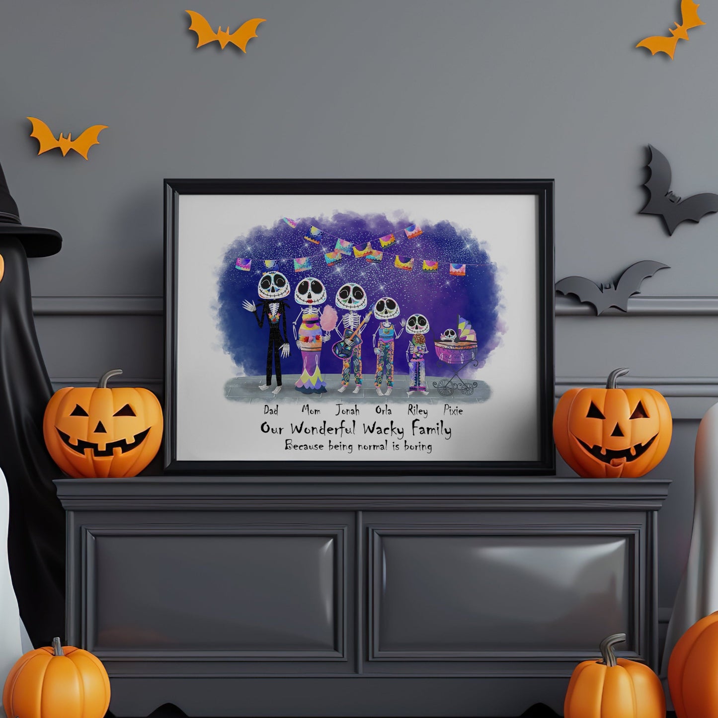 Halloween-themed room with framed family portrait, pumpkins, ghosts, and bats on a gray wall.