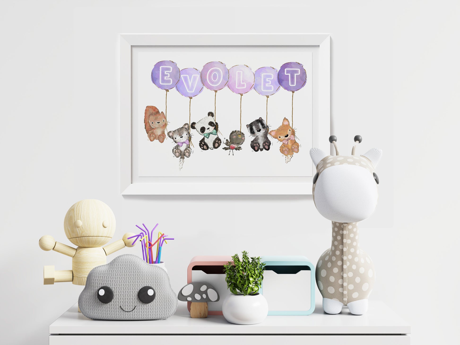 animals holding balloons with letters of baby name on balloons