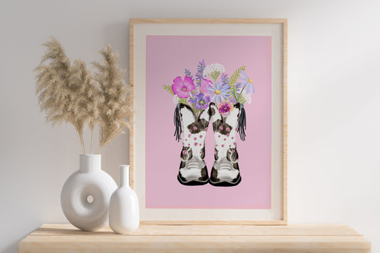 black and white cowboy boots with pink diamante studs used to hold a pretty bouquet of pastel coloured painted flowers, all hand painted