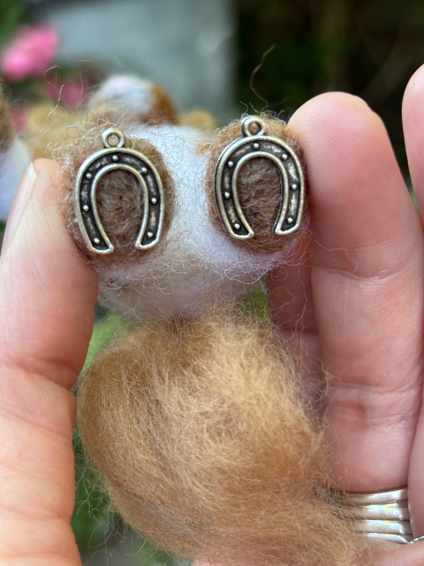 Horse shoe charms on bottom of feet