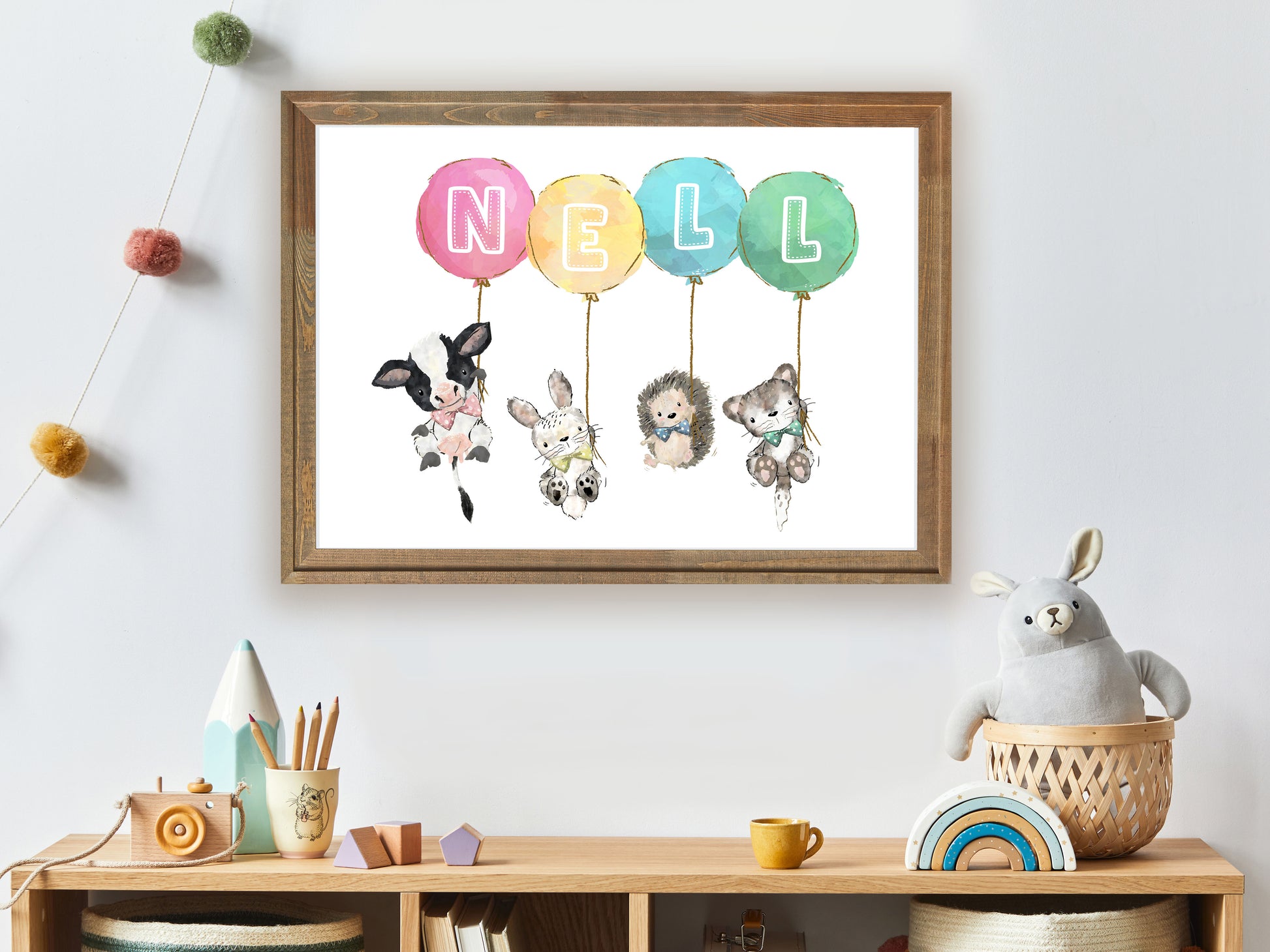 cute animals holding colourful balloons with a child's name letters
